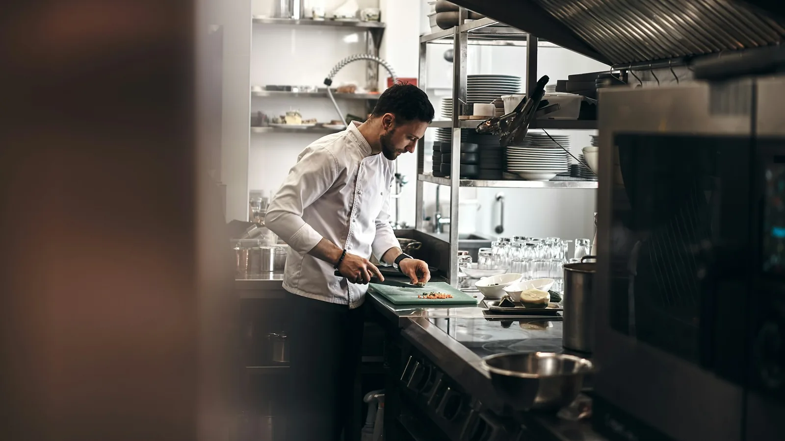 A busy commercial kitchen prep line