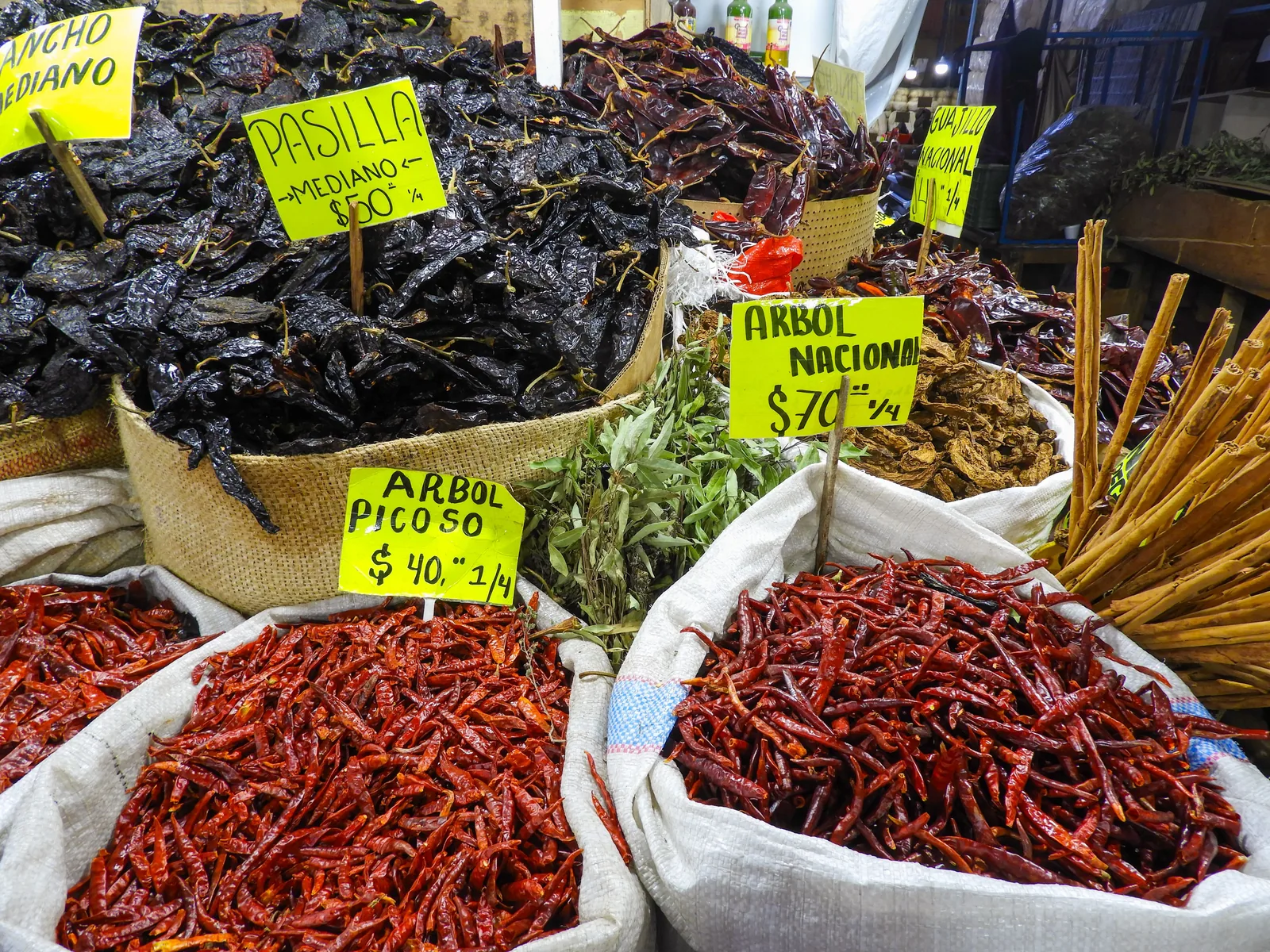 Dried guajillo and ancho chiles alongside achiote paste