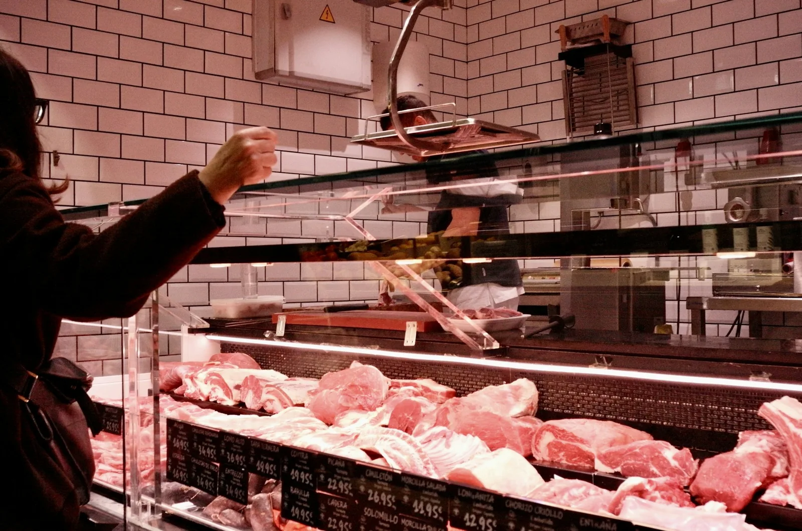 Cuts of beef displayed at a butcher's counter
