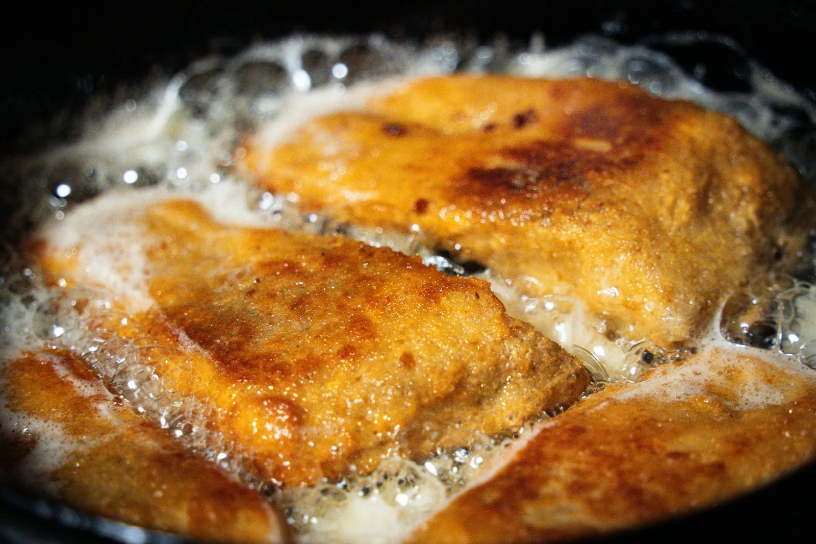 Masa frying in shallow oil until crisp