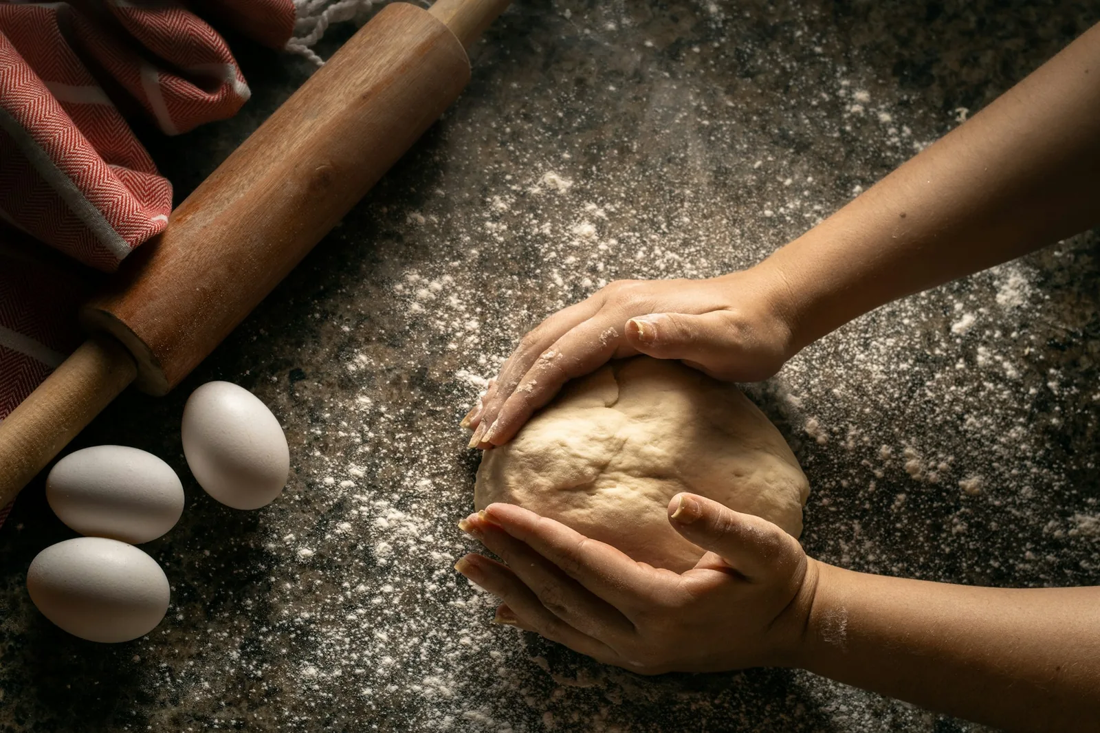 Corn masa being shaped by hand