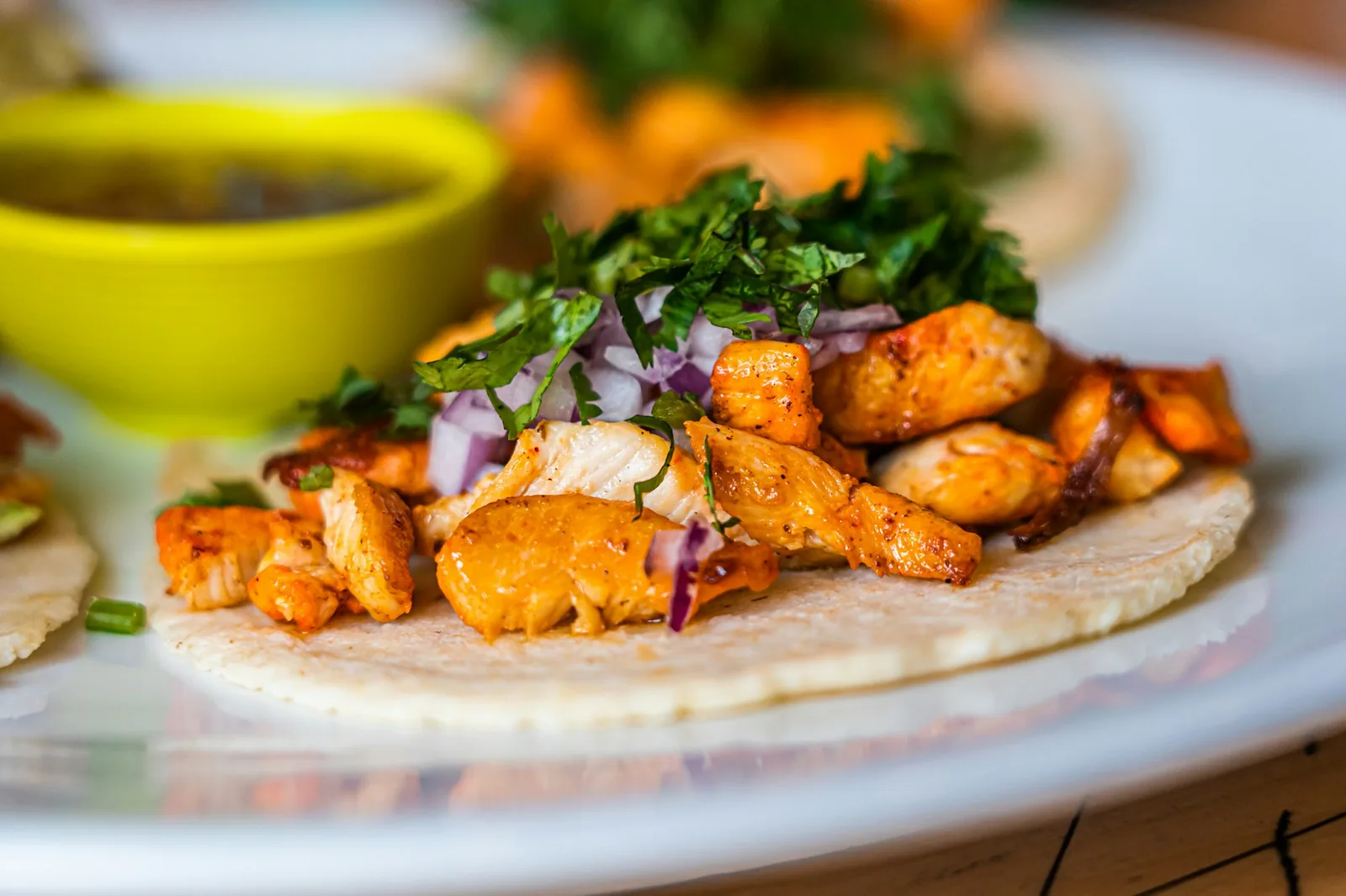Pork tacos on corn tortillas with lime and cilantro