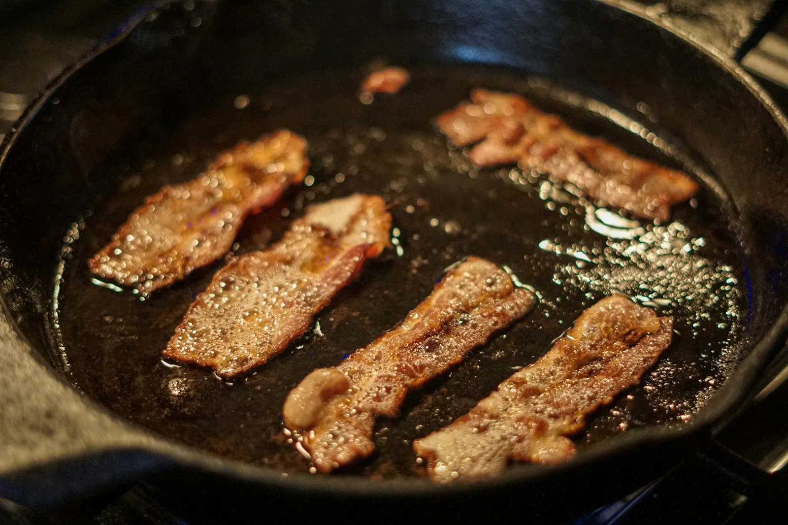 Meat simmering gently in fat