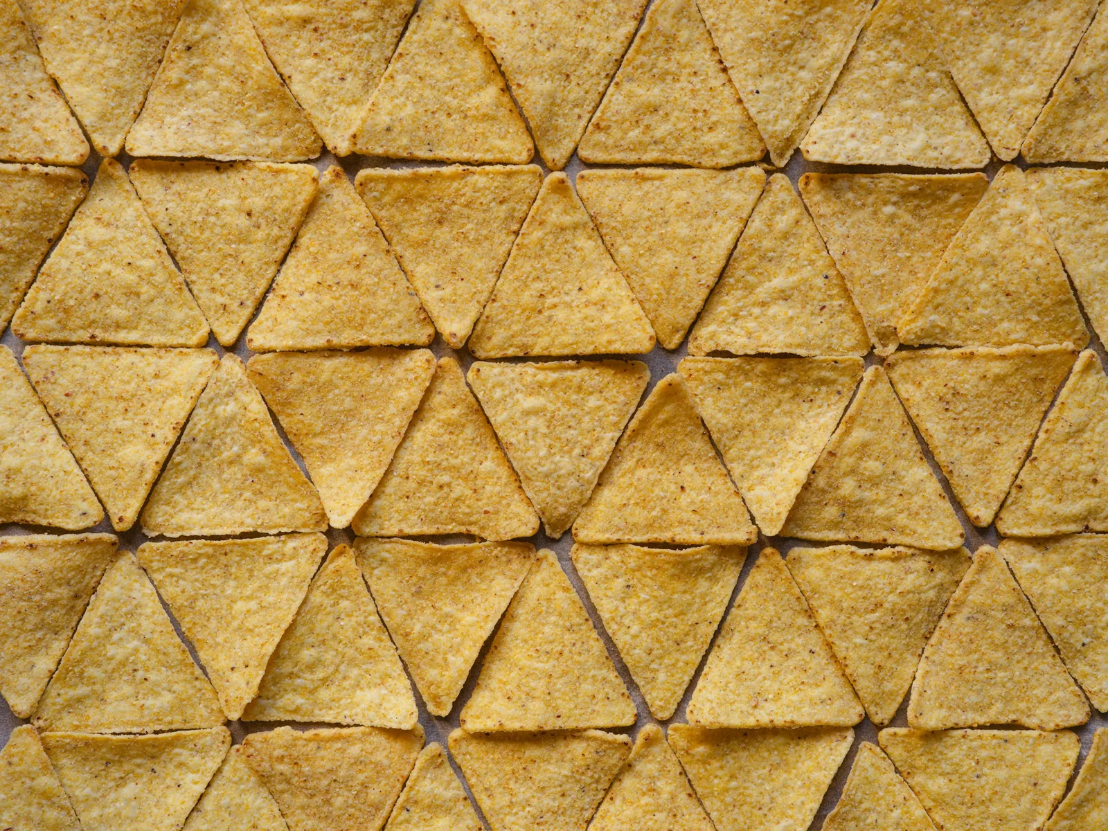 Fried tortilla triangles before saucing