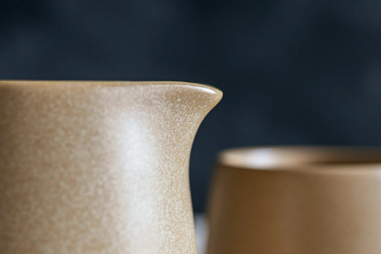 A thin, pourable cream running from a jug