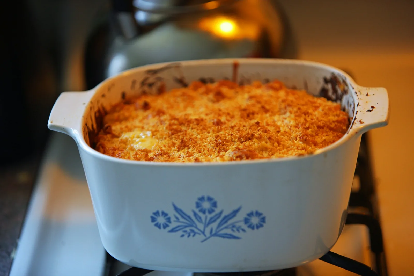 A dish under heavily melted cheese
