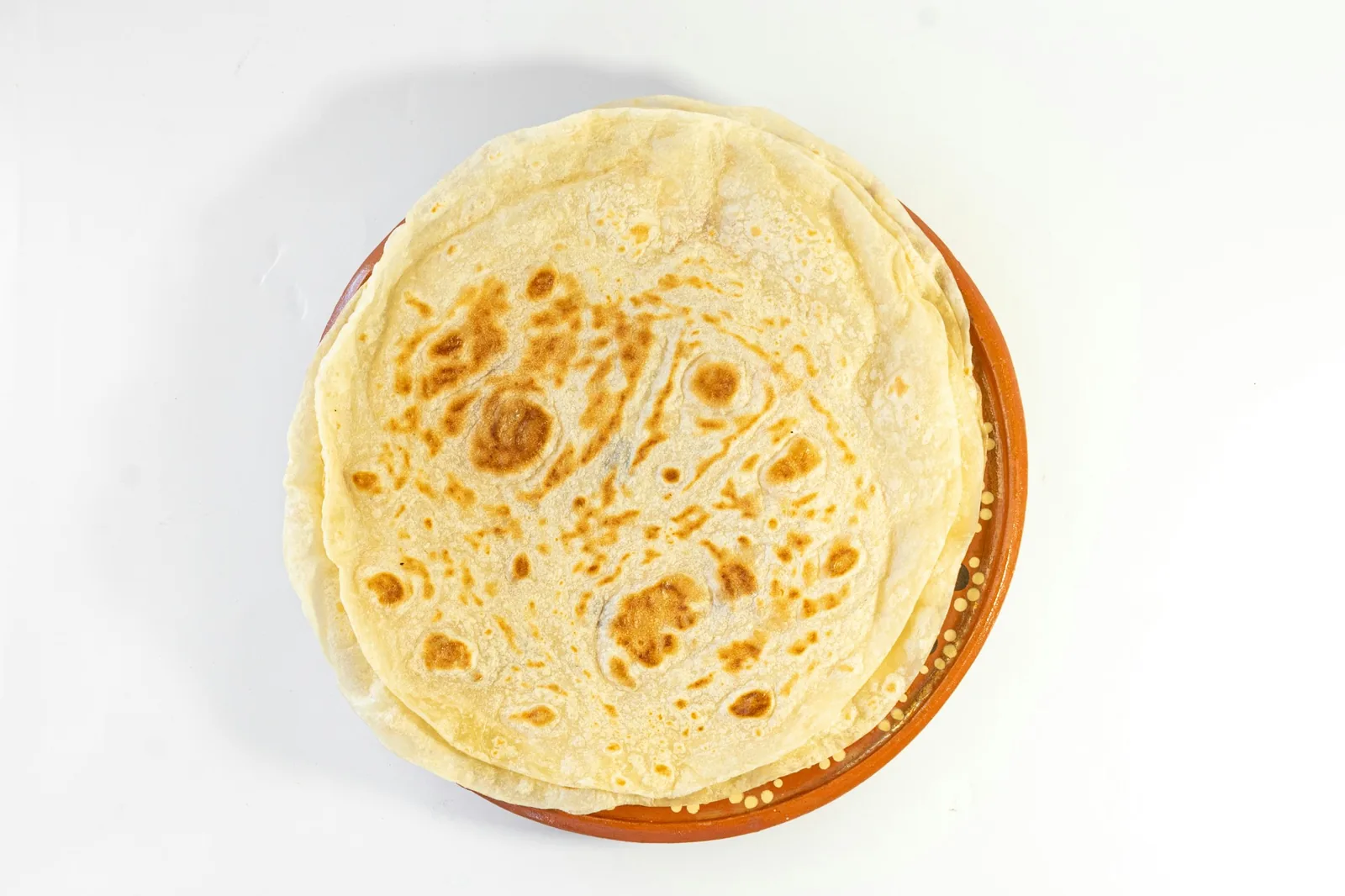 A stack of warm flour tortillas