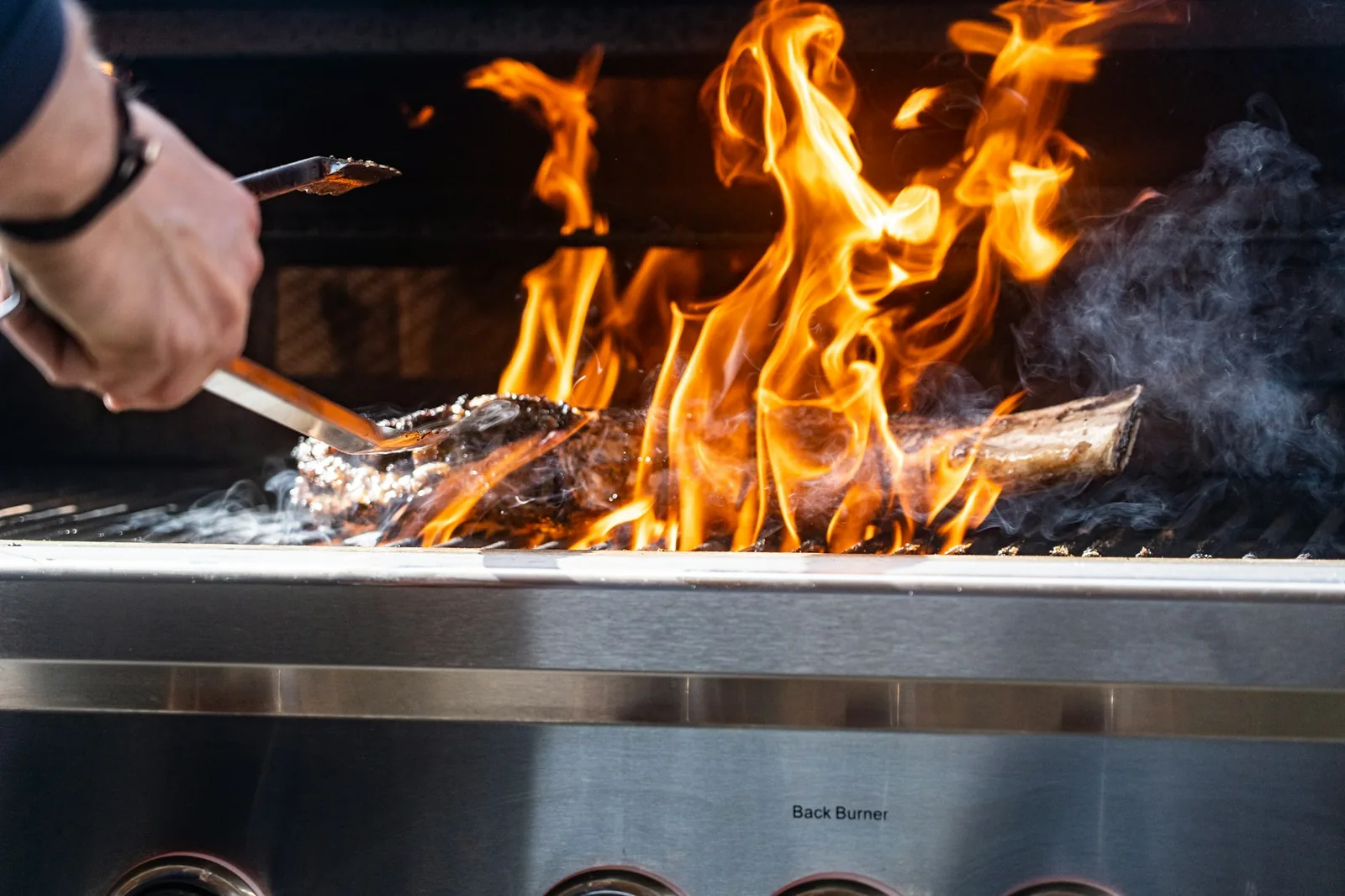 Marinated skirt steak over flame