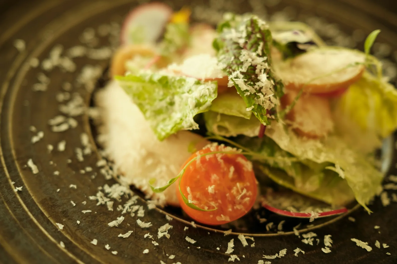 Cream, lettuce and cheese piled over a fried dish