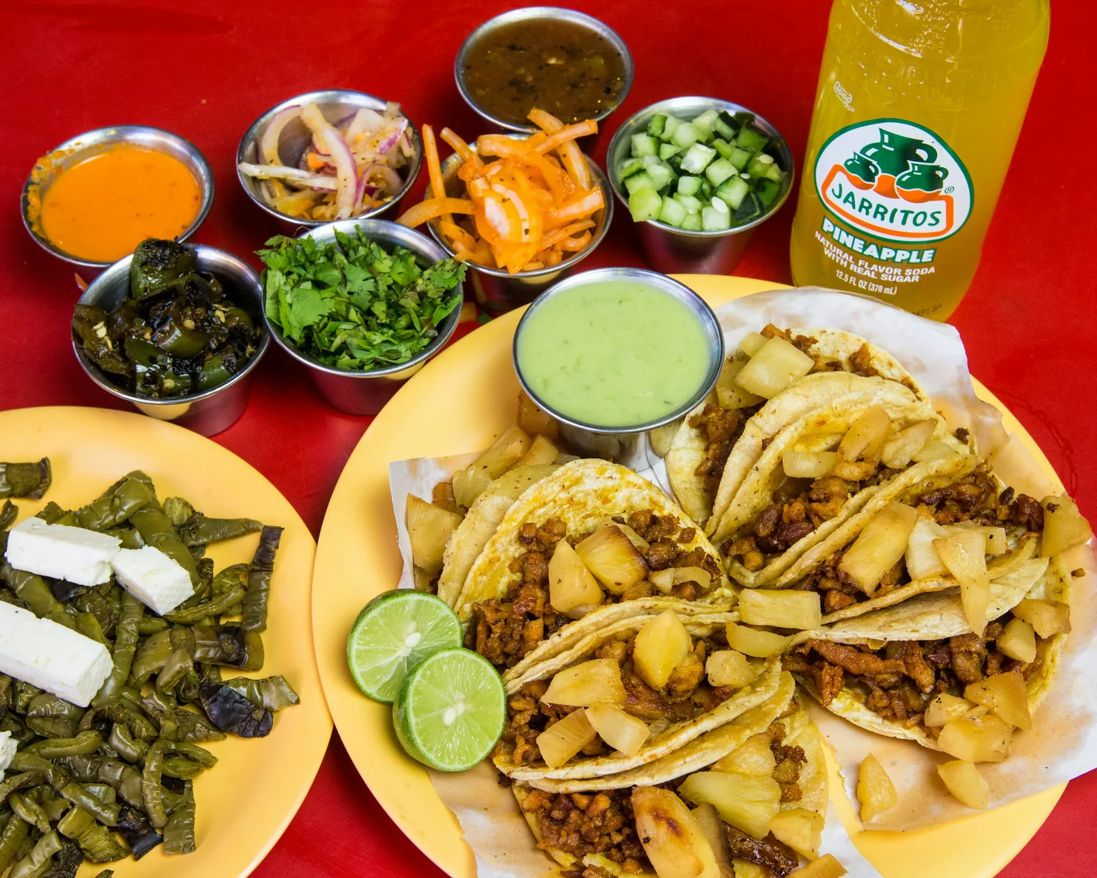 Three plainly built street tacos