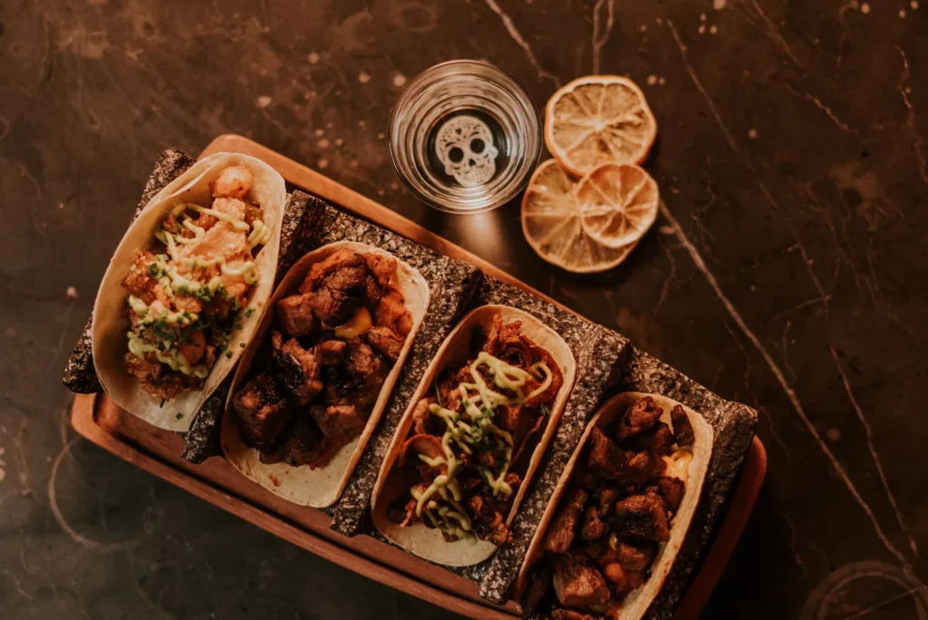 A tray of tacos arranged for a group