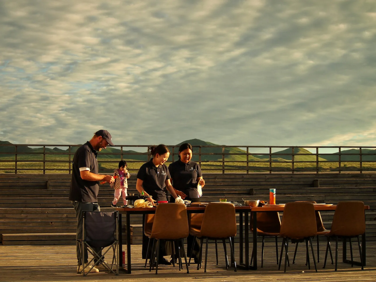 A group sharing Mexican food around an outdoor table