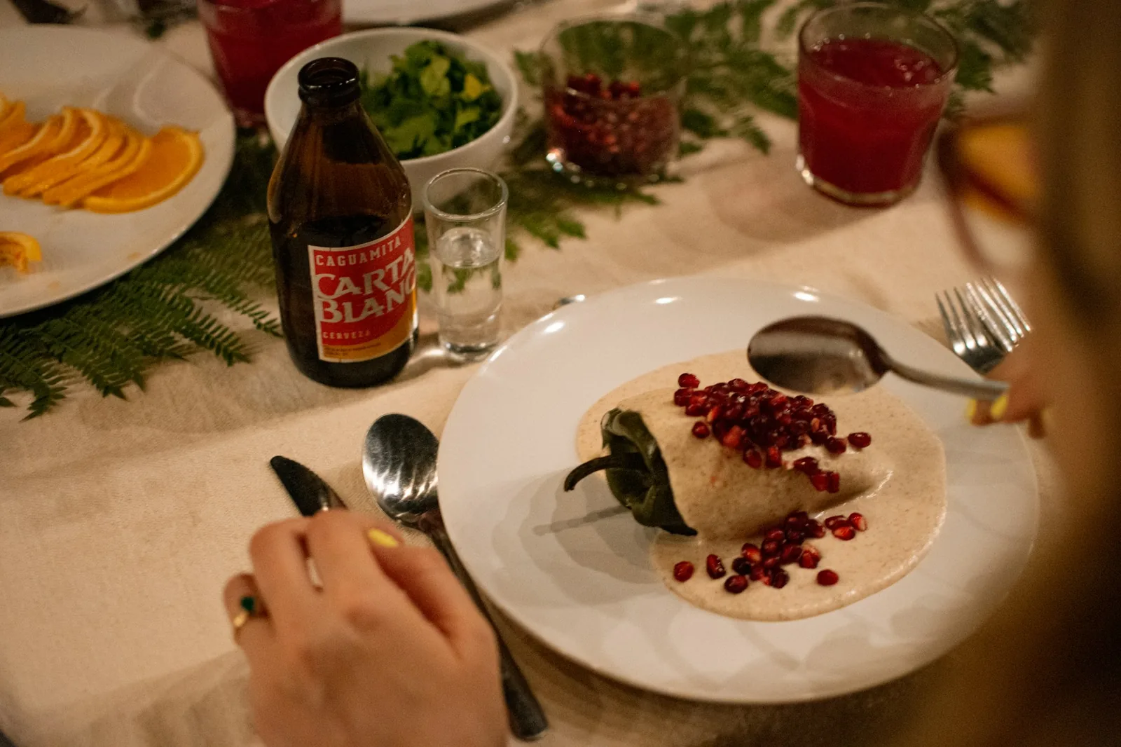 A cold agua fresca served alongside a plate of food