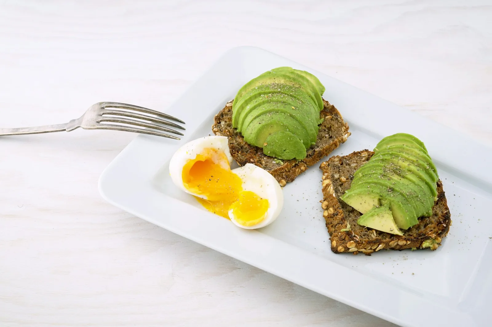 Avocado and cilantro finishing a plate