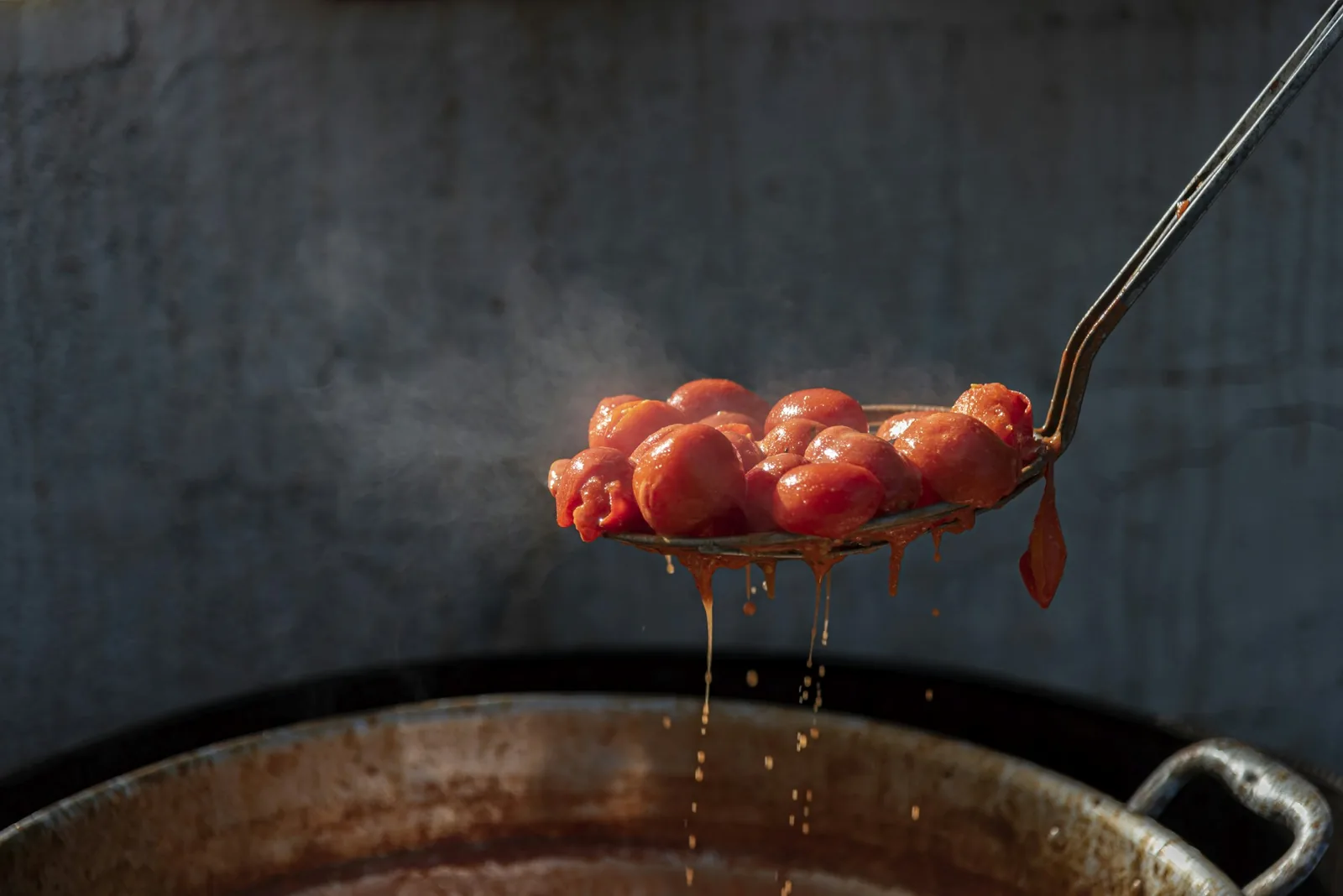 A cooked tomato salsa kept warm