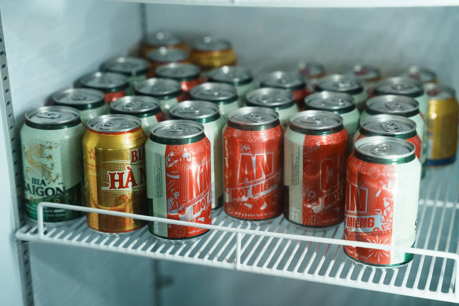 A refrigerator shelf of stored containers