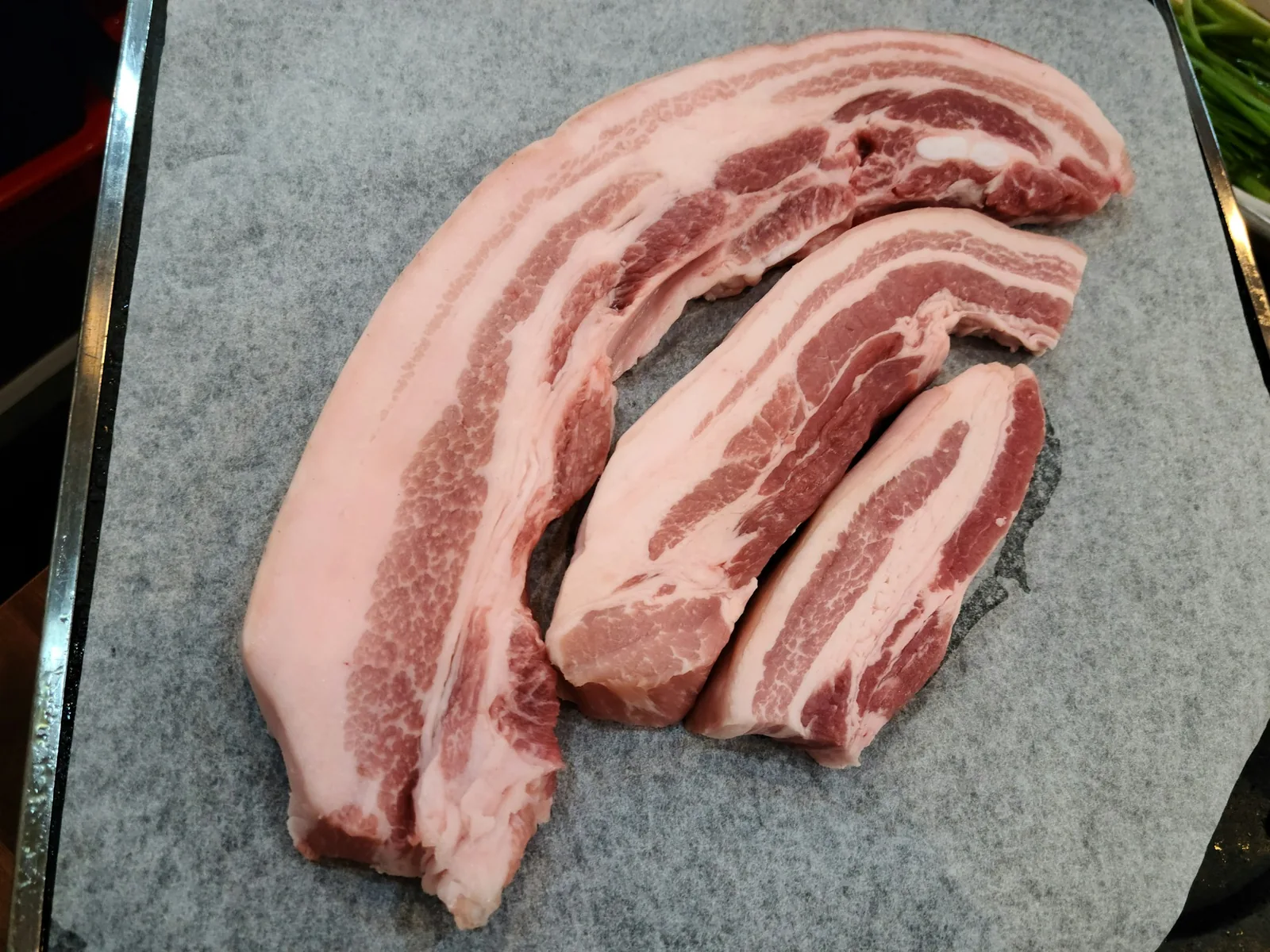Pork cuts at a butcher's counter