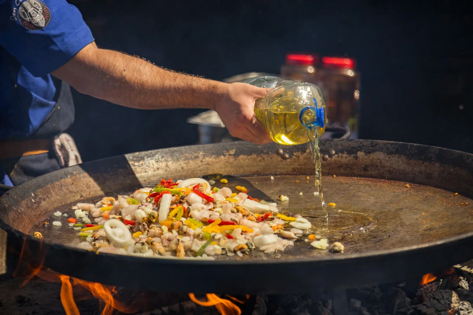 A large pot of fat over a fire