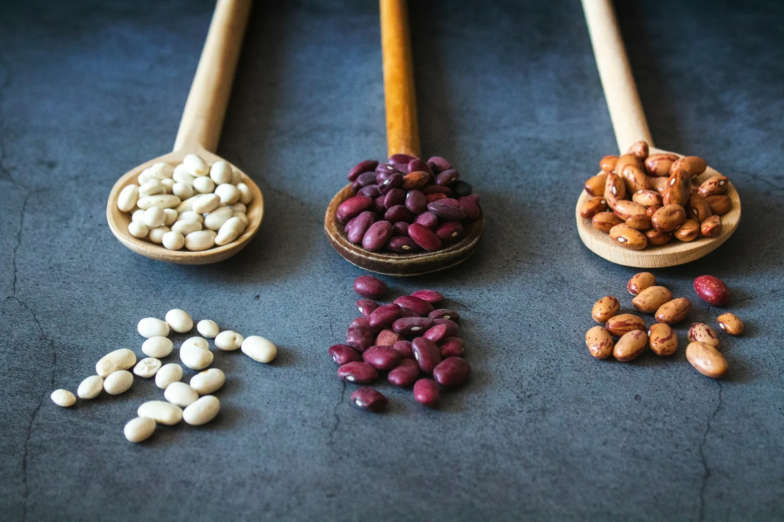 Beans being mashed in hot fat