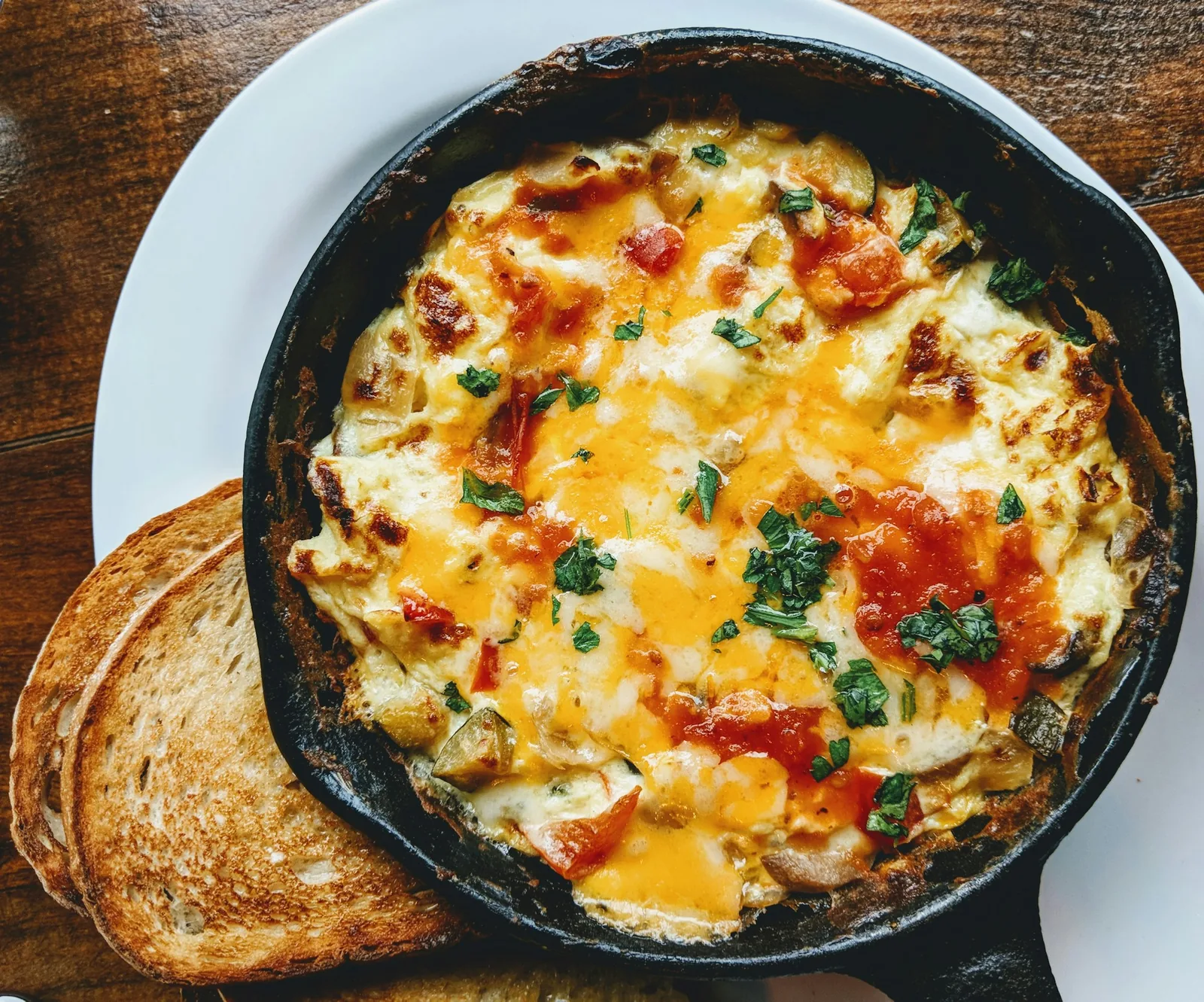 Cheese melted in a skillet and served hot