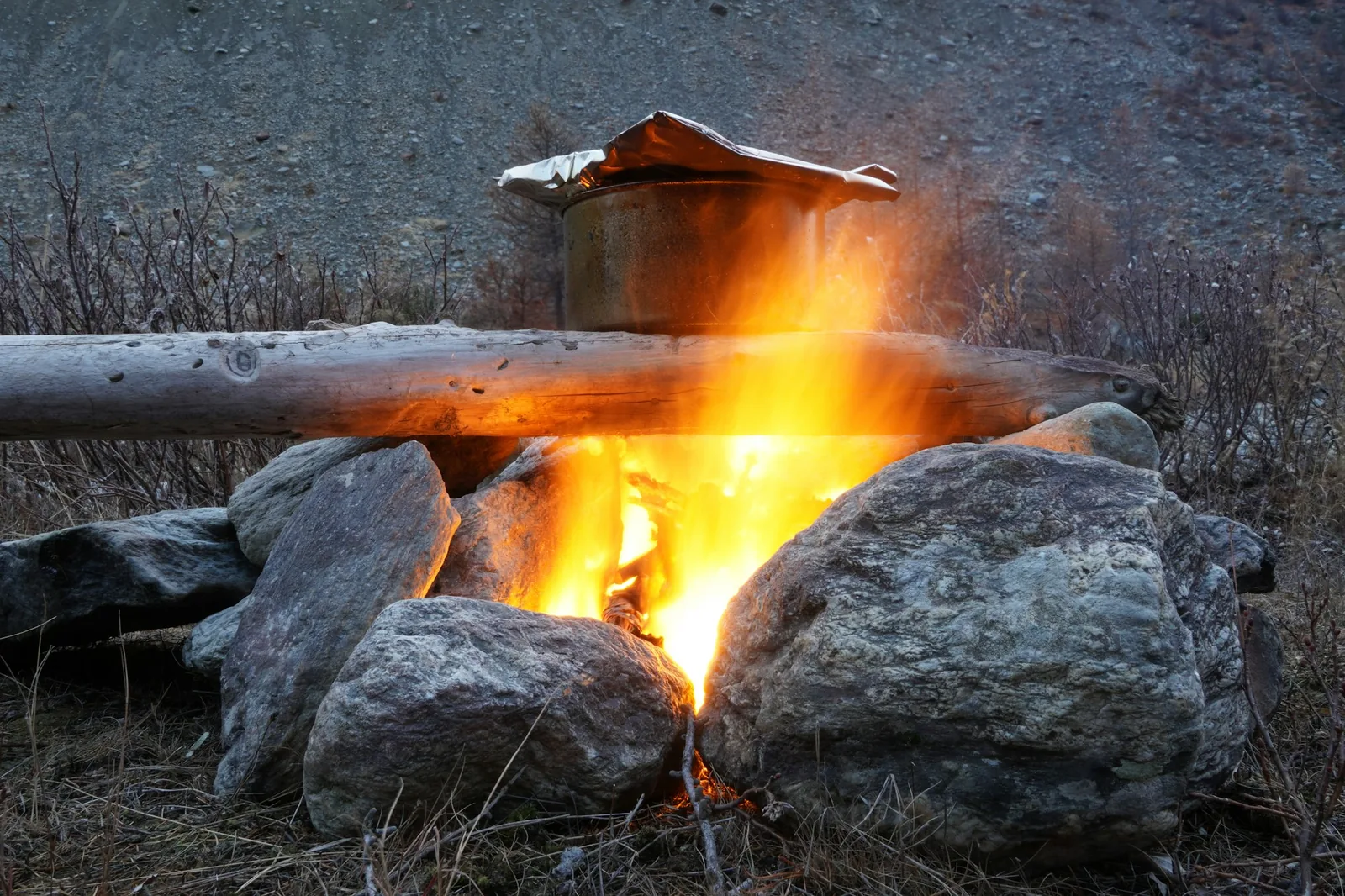 A large copper pot over a fire