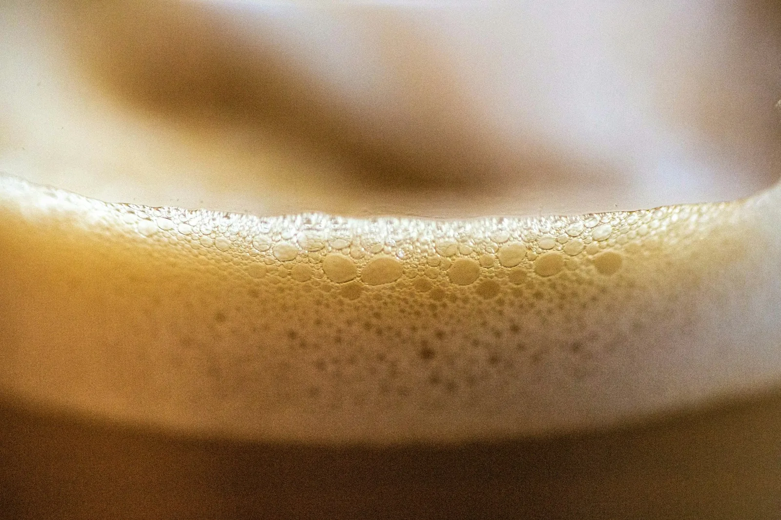 Beer being poured into a chilled glass