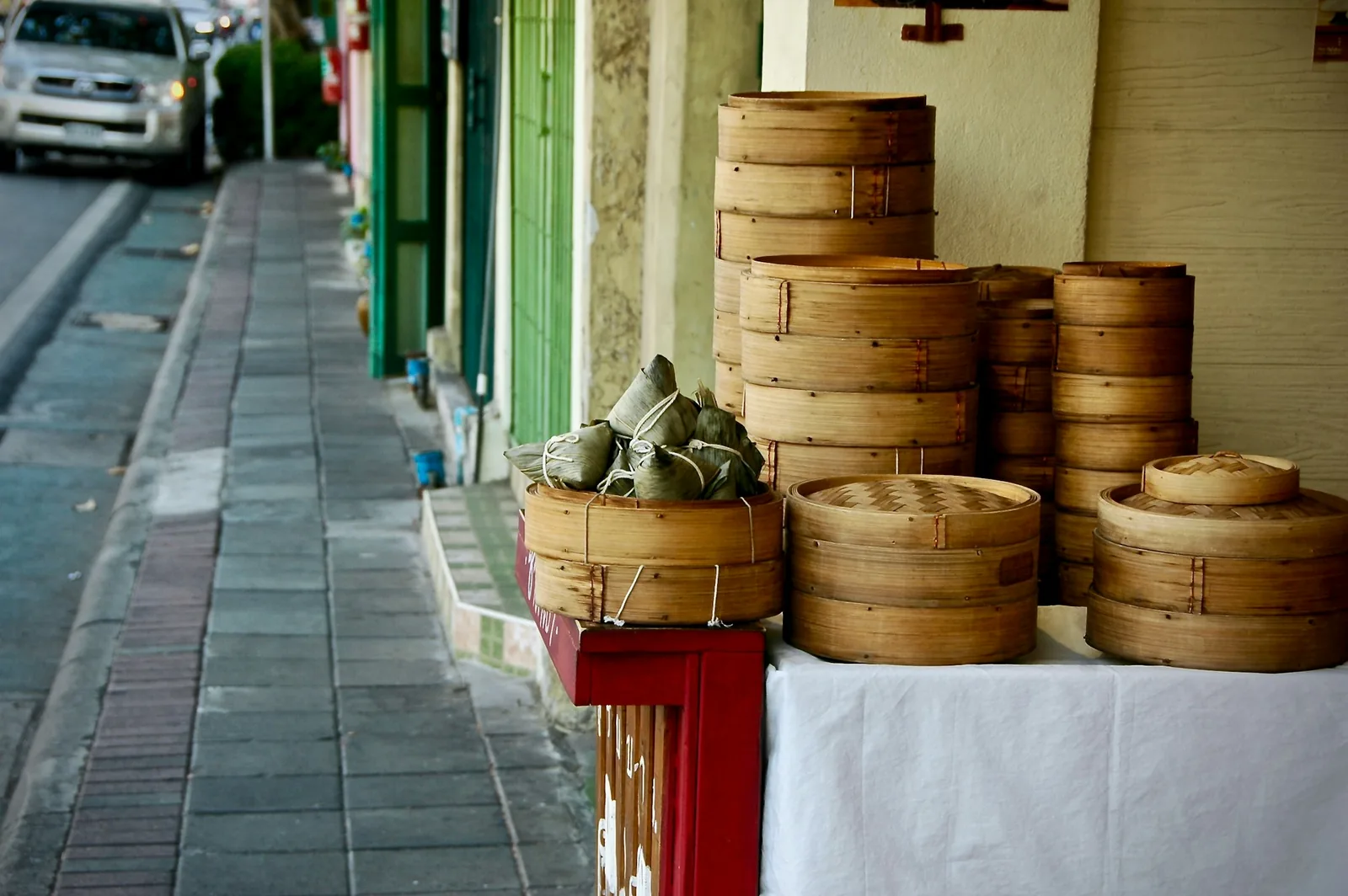 Soft tacos kept warm under cloth in a basket