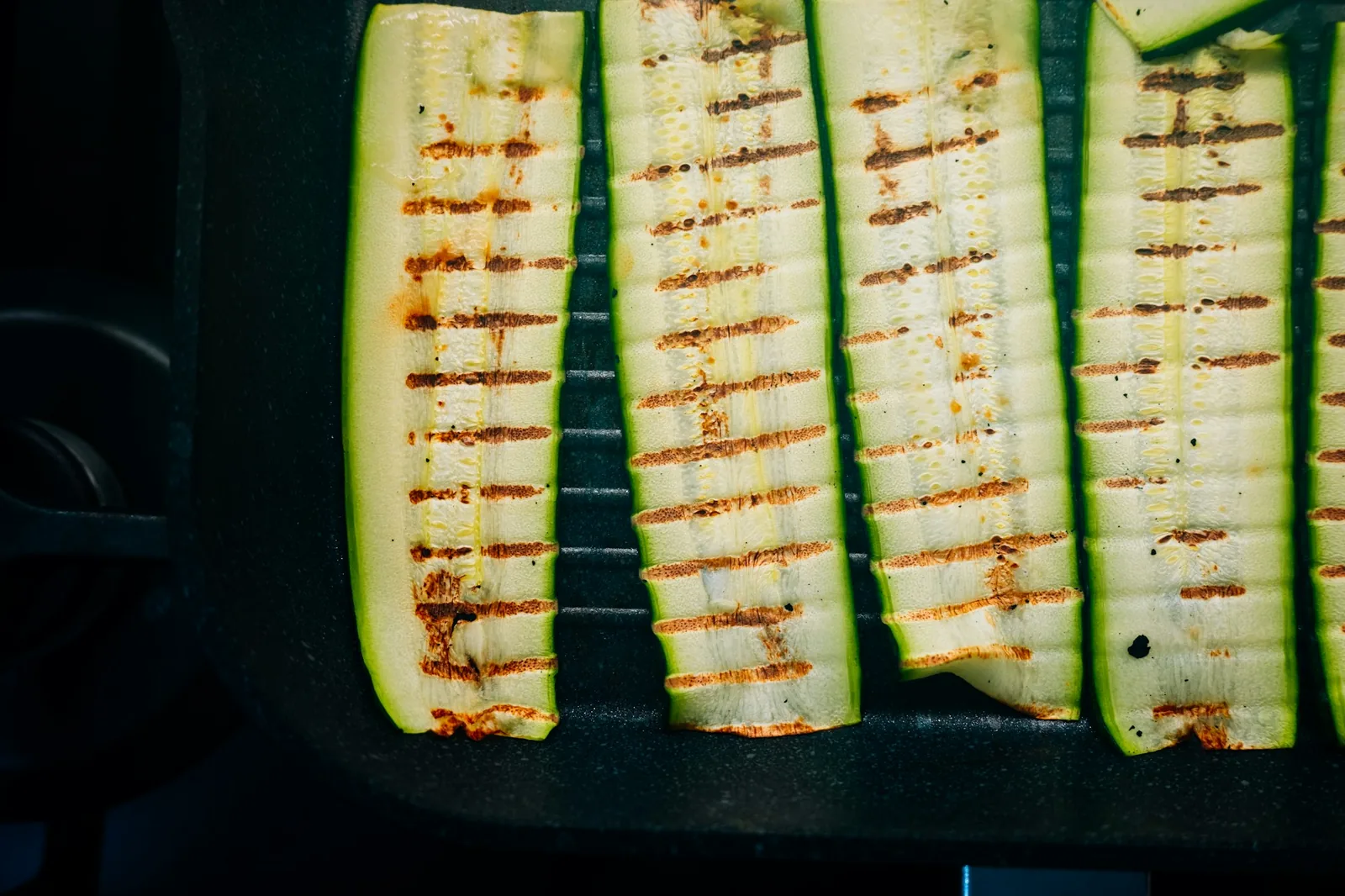 Green strips griddled until charred at the edges