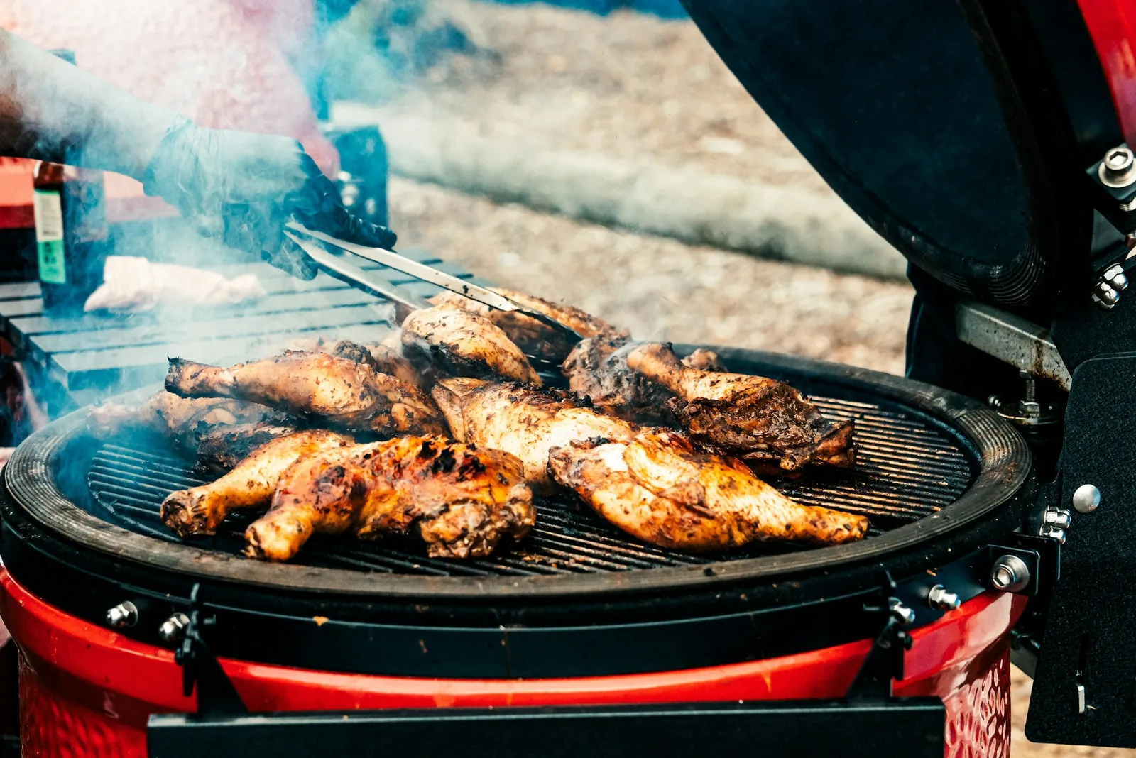 Chicken cooking over charcoal