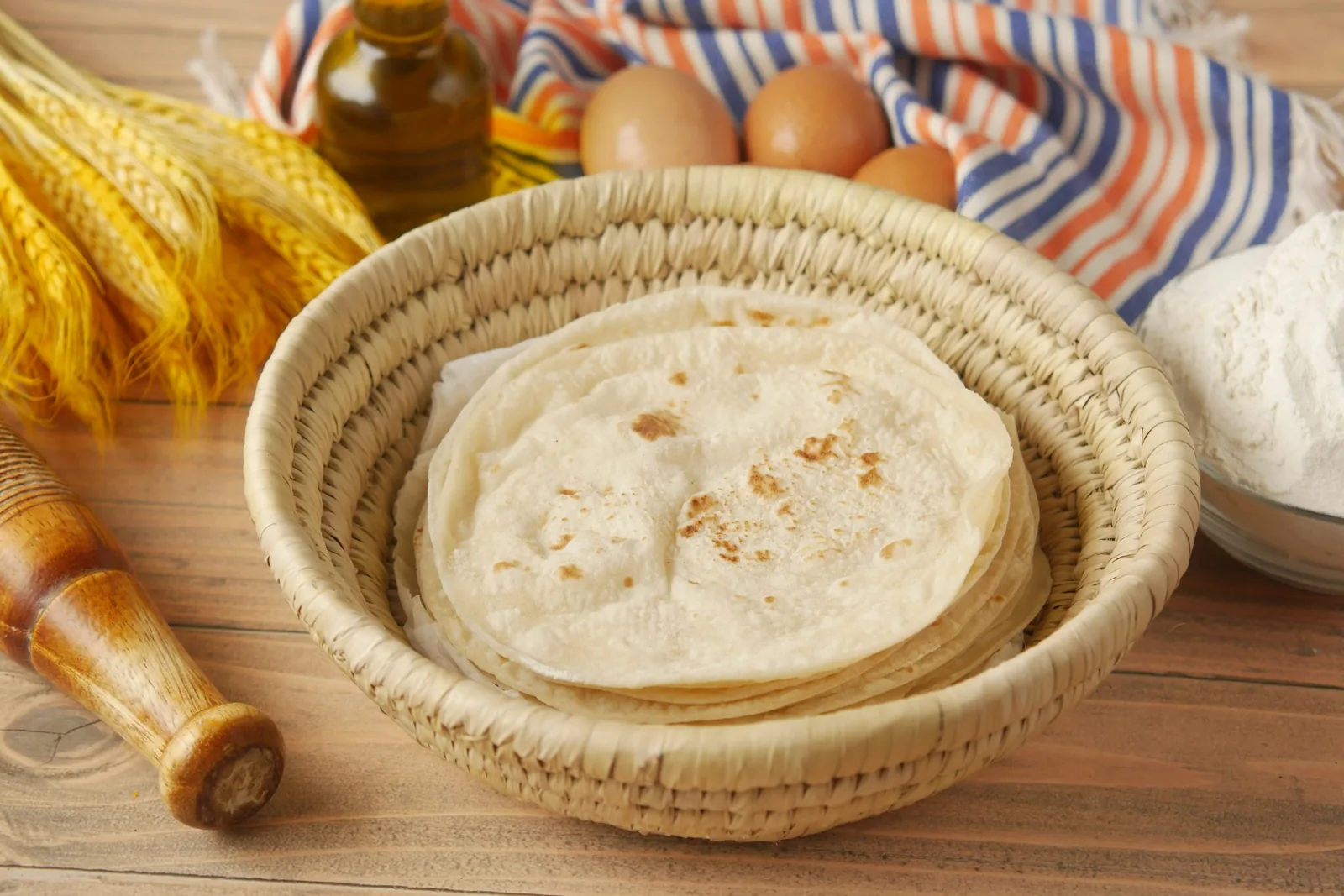 Warm tortillas kept in a cloth-lined basket