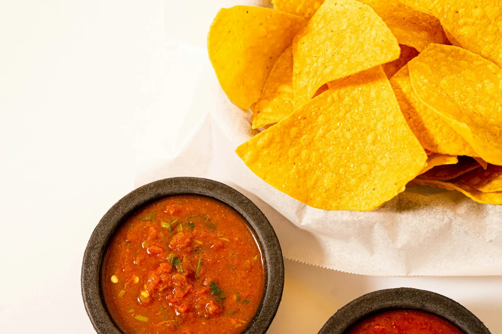 A row of salsas set out to choose from