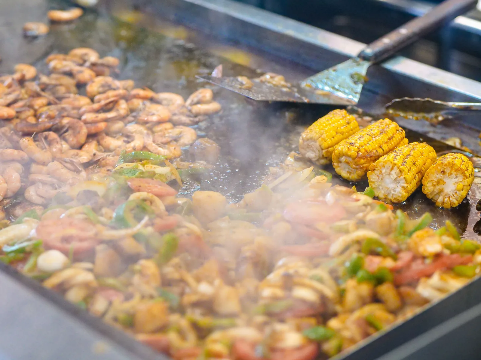 A street vendor working a comal