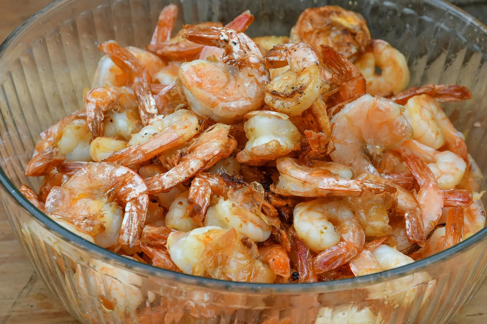 An American-style shrimp cocktail hung on the rim of a glass