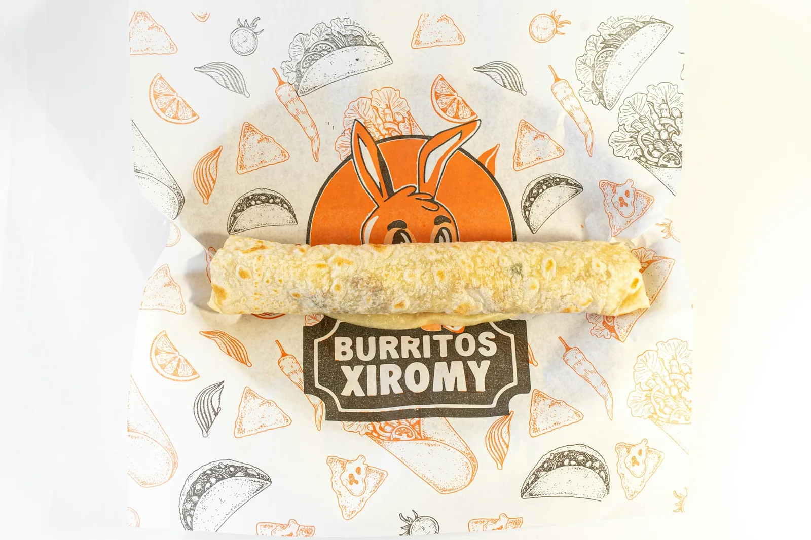 A large burrito rolled in a flour tortilla