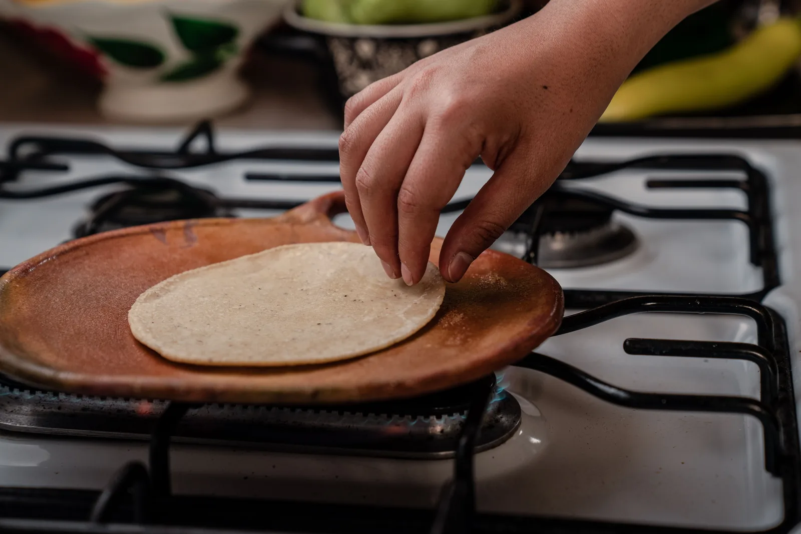 Tortillas crisping on a hot flat griddle