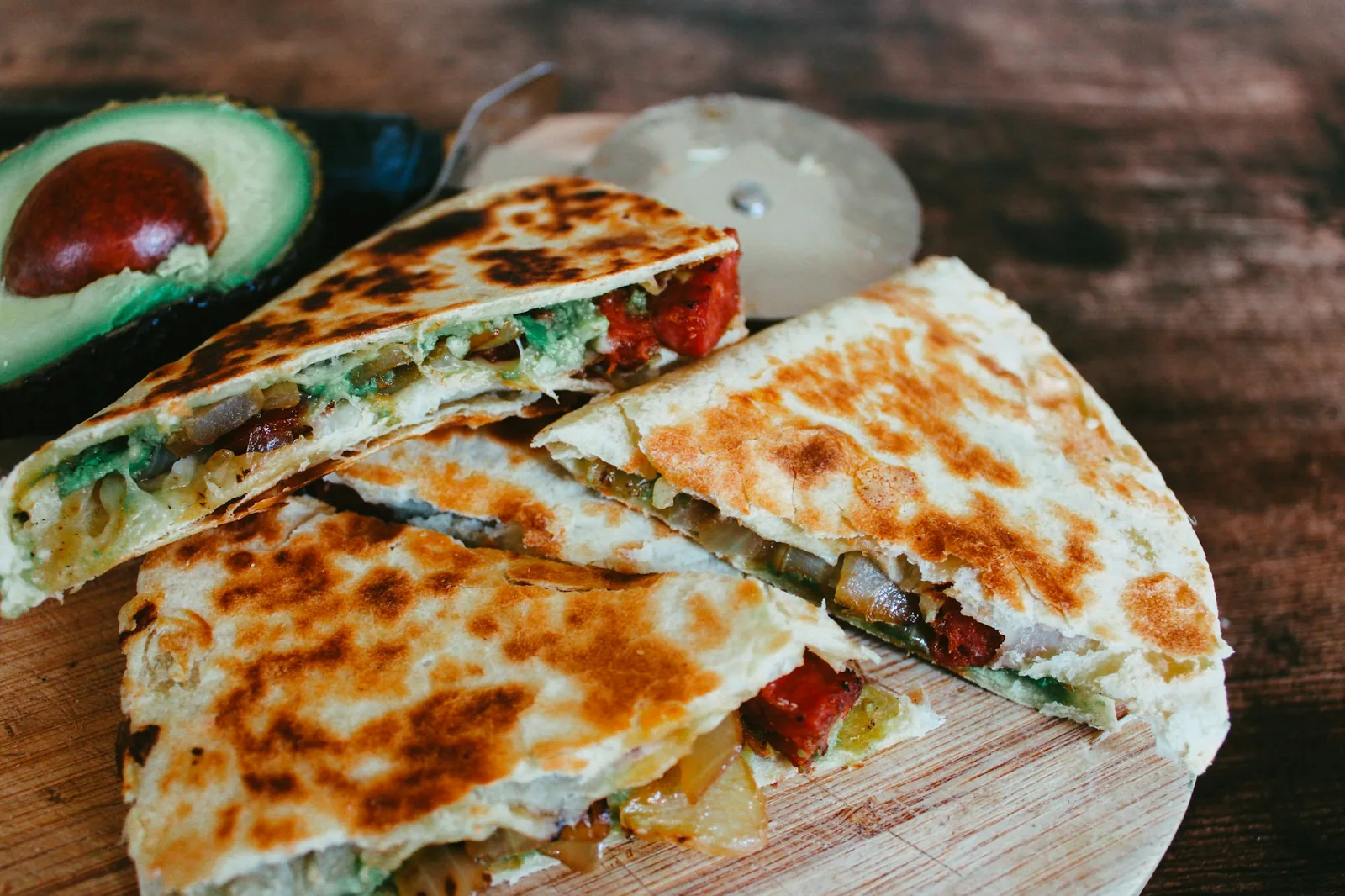 A crisp griddled corn tortilla with melted cheese inside