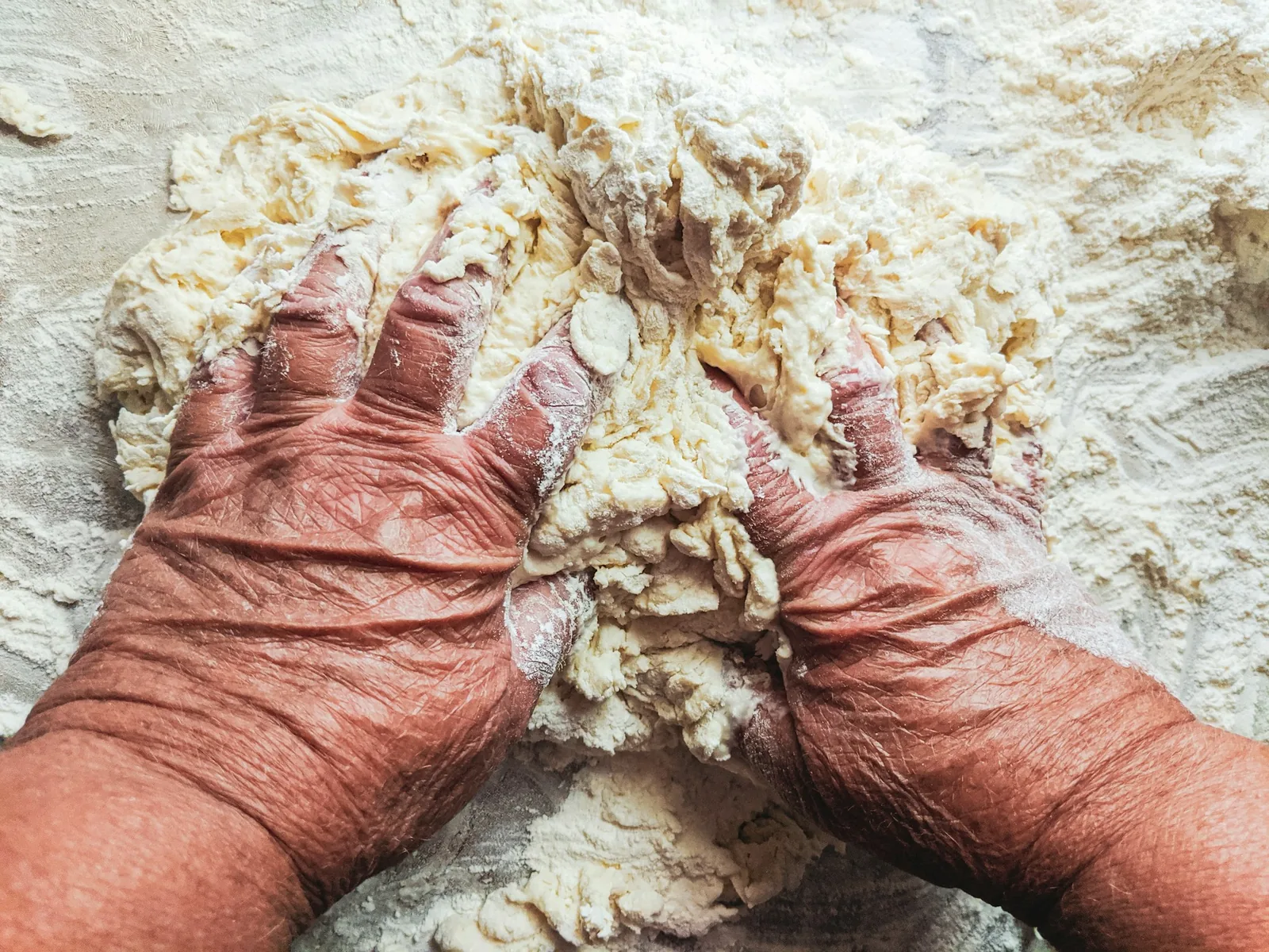 Masa being spread onto a soaked husk