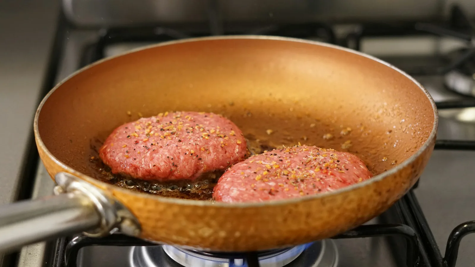 Seasoned ground beef cooking in a skillet