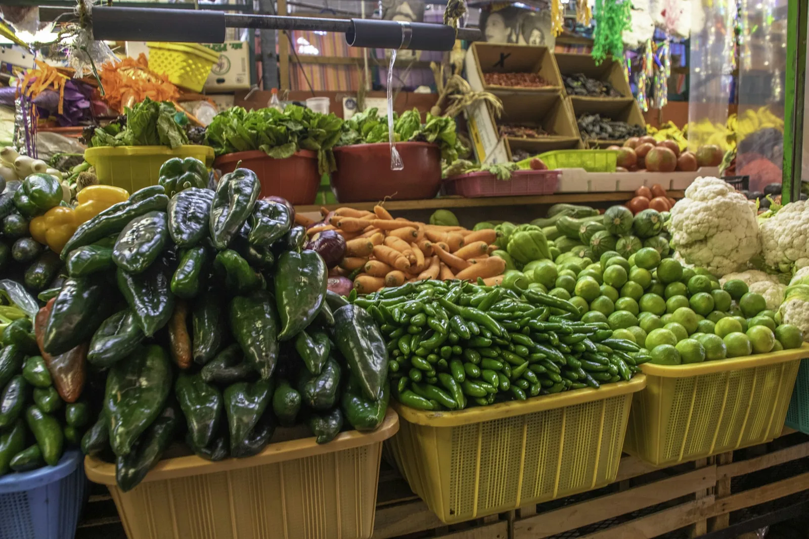 A Mexican market stall of fresh chillies and produce