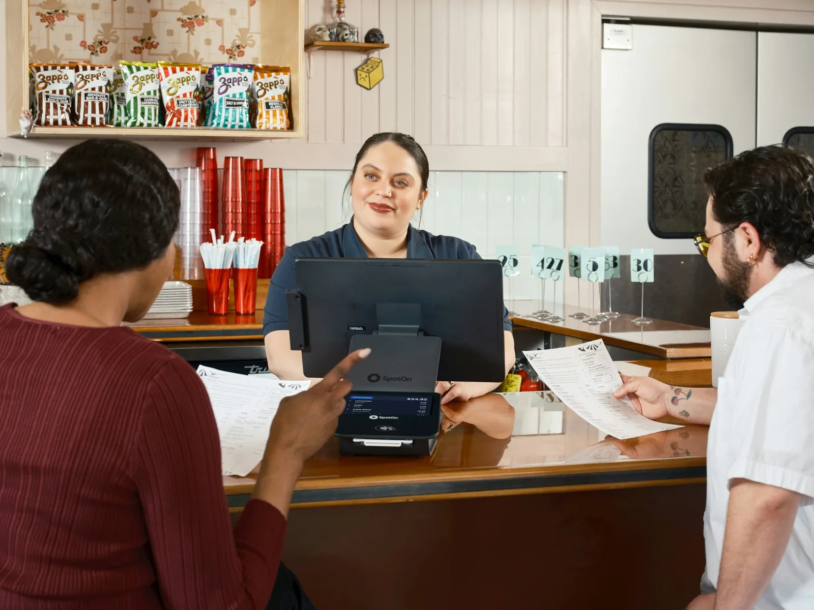 A customer asking a question at a counter